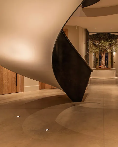 Helical staircase uplit with ground recessed uplights