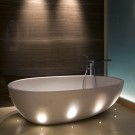 LD60 uplighting a striking modern bath.  Lighting Design by Brilliant Lighting