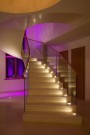 LD64 lighting a dramatic, curved staircase