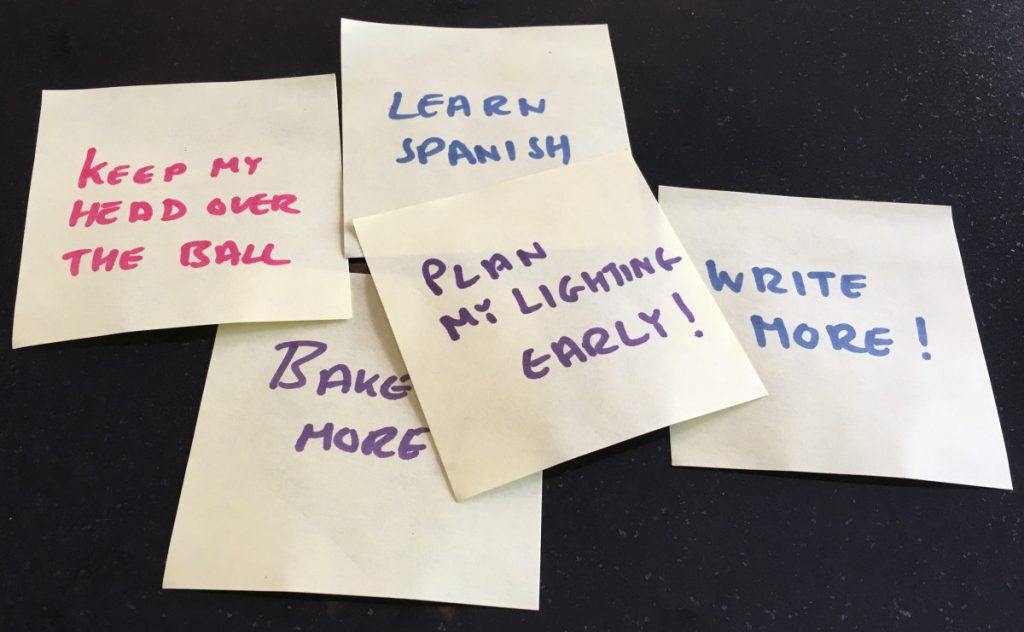 Post It notes with New Years Resolutions including "Plan My Lighting Early!"